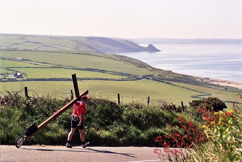 Counties evangelist Clive Cornish walks with his cross around the beautiful coast of Wales. Beach scenery near Newgale