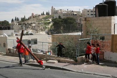 Counties evangelist Clive Cornish climbs the Mount of Olives outside Jerusalem with his cross. Local children watch with interest – during a project called From Jerusalem to Rome in the Footsteps of the Apostle Paul. Counties evangelist Clive Cornish climbs the Mount of Olives outside Jerusalem with his cross. Local children watch with interest - during a project called From Jerusalem to Rome in the Footsteps of the Apostle Paul.