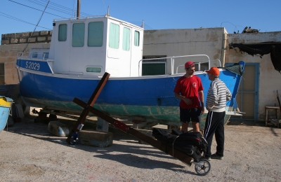 A local fishing boat and fisherman in Malta - photographed during a project called From Jerusalem to Rome in the Footsteps of the Apostle Paul.