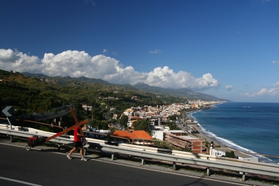 Counties evangelist Clive Cornish walks with his cross along the Sicilian coast – magnificent views during a project called From Jerusalem to Rome in the Footsteps of the Apostle Paul. Counties evangelist Clive Cornish walks with his cross along the Sicilian coast - magnificent views during a project called From Jerusalem to Rome in the Footsteps of the Apostle Paul.