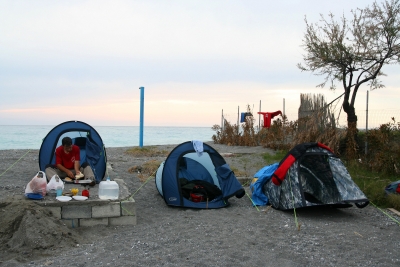 Counties evangelist Clive Cornish camping on the beach as he walks with his cross through Italy – photographed during a project called From Jerusalem to Rome in the Footsteps of the Apostle Paul. Counties evangelist Clive Cornish camping on the beach as he walks with his cross through Italy - photographed during a project called From Jerusalem to Rome in the Footsteps of the Apostle Paul.