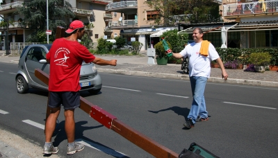 A stranger in Italy gives Counties evangelist Clive Cornish a bottle water – photographed during a project called From Jerusalem to Rome in the Footsteps of the Apostle Paul. A stranger in Italy gives Counties evangelist Clive Cornish a bottle water - photographed during a project called From Jerusalem to Rome in the Footsteps of the Apostle Paul.