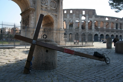 A Christian cross with the coliseum behind – photographed during a project called From Jerusalem to Rome in the Footsteps of the Apostle Paul. A Christian cross with the coliseum behind - photographed during a project called From Jerusalem to Rome in the Footsteps of the Apostle Paul.