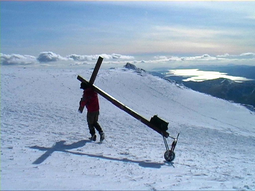 Counties evangelsit approaches the summit of Ben Nevis after a gruelling climb in snow with his cross