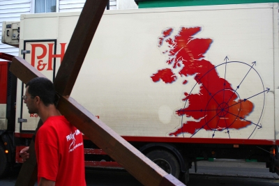 Counties evangelist Clive Cornish carries his cross past a van showing a map of the UK. The photograph was taken by Lathan Ball as they walked from John O'Groats to Land's End.